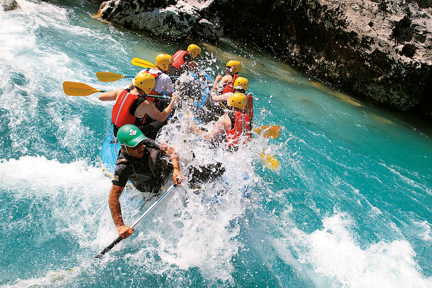 A group enjoying the Soča river rapids