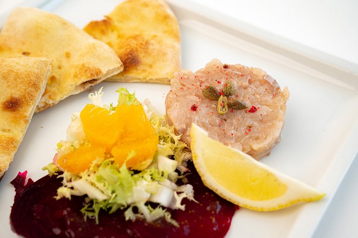 Letni vrt • Trout tartar with beetroot, salad, citrus fruits and fig jam • Soča Valley Finest